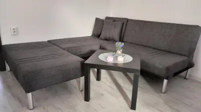 a living room with a couch and a table at Tea House Samokov in Samokov