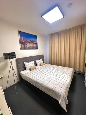 a bedroom with a large bed in a room at 2 Bedroom Apartment with Garage in Sandanski
