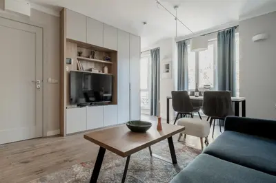 a living room with a couch and a table at 8th Hill Apartments in Plovdiv