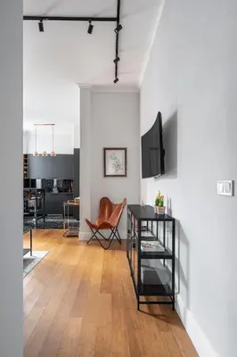 a living room with a table and a dining room at NEW High-End 2BR Apartment with Parking in Sofia