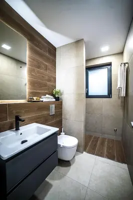 a bathroom with a white sink and a toilet at ARHEYA 3 apart АРХЕЯ 3 апартамент за гости in Karlovo