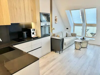 a kitchen and living room with a couch and a table at City Modern & Classy Apartment for 4 Guests & Parking in Sofia