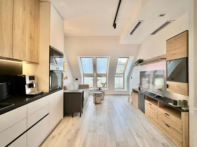 a large kitchen with wooden floors and windows at City Modern & Classy Apartment for 4 Guests & Parking in Sofia
