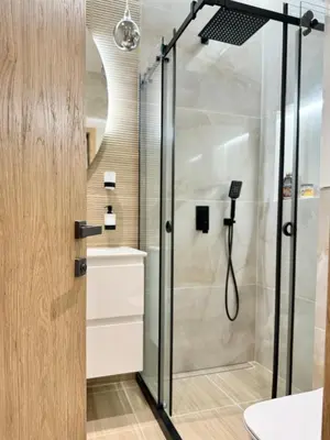 a shower with a glass door in a bathroom at City Modern & Classy Apartment for 4 Guests & Parking in Sofia