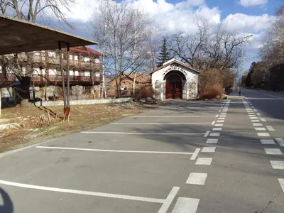 an empty parking lot in front of a building at Sapphire Mountain 1 in Bansko