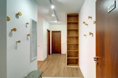 a room with a hallway with a door and a shelf at N.Joy Holiday Apartment 534 by Oak Residence in Smolyan