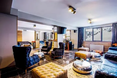 a large living room with couches and chairs at N.Joy Holiday Apartment 417 by Sunny Hills in Pamporovo