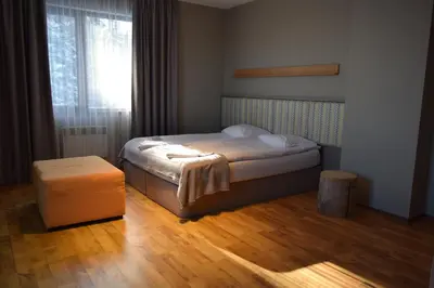 a small bedroom with a bed and a window at N.Joy Holiday Apartment 417 by Sunny Hills in Pamporovo