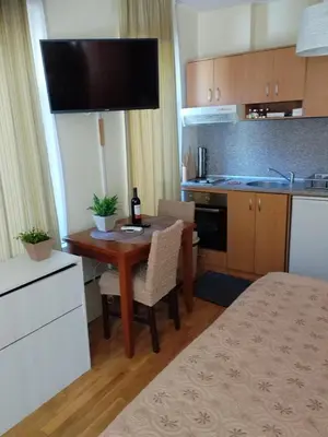 a small kitchen with a table in a room at Predela 1 - Studio 04 near Bansko Ski Lift in Bansko