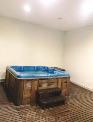 a blue tub in the corner of a room at Predela 1 - Studio 04 near Bansko Ski Lift in Bansko