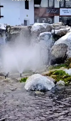 a water fall with snow on top of it at Ski view suite Emerald Bansko in Bansko