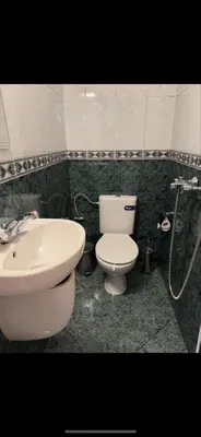 a bathroom with a toilet and a sink at Deers in Bansko