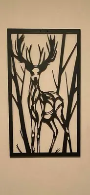 a black painting of a deer on a wall at Deers in Bansko