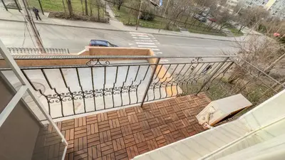 a view of a balcony with a street and a car at Апартамент Панчо in Sofia
