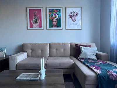 a living room with a couch and a table at Harmony apartment in Sofia