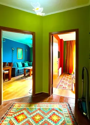 a living room with green walls and a living room at Cedar Lodge III One BDRM Flat B2 in Bansko