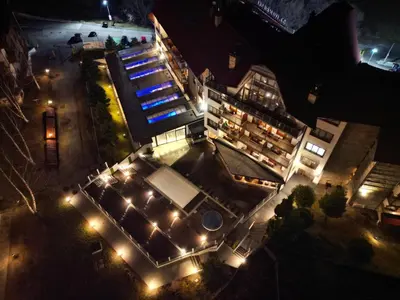 an overhead view of a building with lights at night at Private 1bedroom apt in SPA Resort - SPA included in Bansko