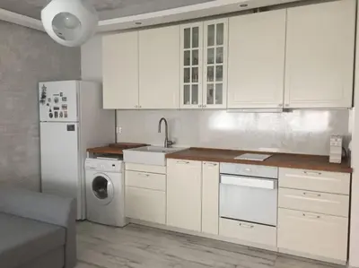a kitchen with white cabinets and a washer and dryer at Cozy and modern apartment Krasno selo, free parking in Sofia