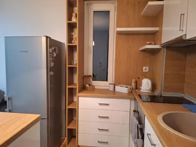 a kitchen with a refrigerator and a sink at Danaya in Petrich