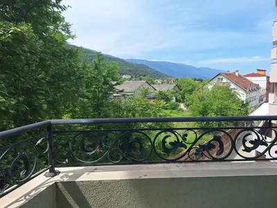 a balcony with a view of a city at Danaya in Petrich