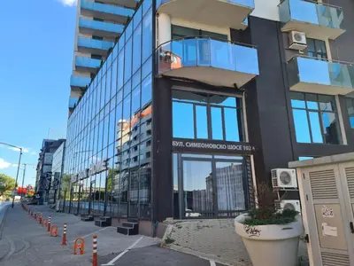 a building with a sign on the side of it at Boutique Magenta Pearl Apartment with free WiFi in Sofia