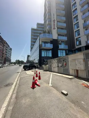 a row of traffic cones on the side of a street at Boutique Magenta Pearl Apartment with free WiFi in Sofia