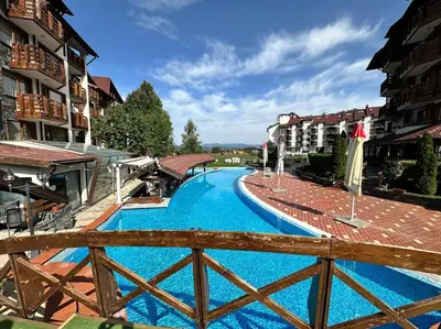 a view of a swimming pool in a resort at Belvedere Holiday Club nice place in Bansko