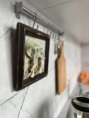 a picture on a wall with a picture of a skull at Къщата на Анхел in Sofia