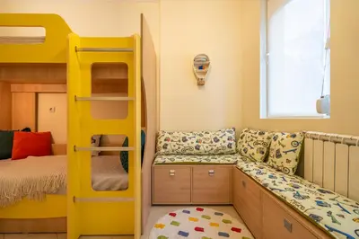 a bedroom with a bunk bed and a yellow bunk bed at Premium comfy 2BDR Apt - Free Parking - Fast Wi-Fi in Sofia