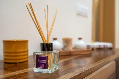 a bottle of alchemist perfume on a wooden table at Premium comfy 2BDR Apt - Free Parking - Fast Wi-Fi in Sofia