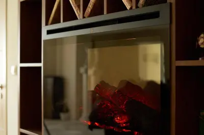 a fire in a microwave oven in a room at Guest House Mira in Sapareva Banya