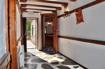 a hallway of a house with an open door at Къща за гости Родопчани in Smolyan