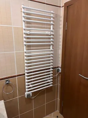 a bathroom with a shower with a towel rack at Mountain Cedar Pine 1 BR Apt near Ski Gondola in Bansko