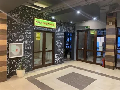 a restaurant with a black wall with writing on it at Apartment B45 Borovets Gardans in Borovets