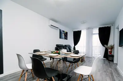 a dining room with a table and chairs at PANORAMA SPA ASPEN APARTMENT in Razlog
