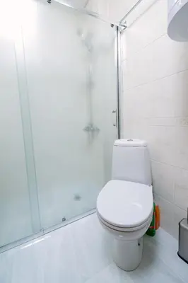 a bathroom with a toilet and a shower at PANORAMA SPA ASPEN APARTMENT in Razlog