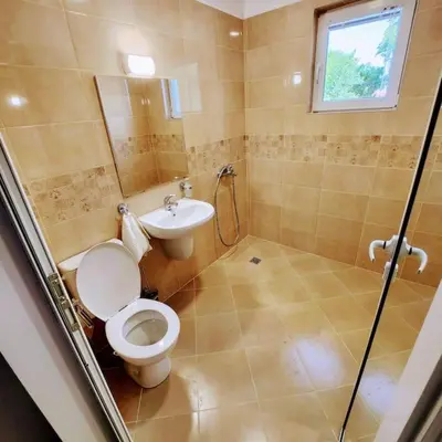 a bathroom with a toilet and a sink at Aпартамент-София/ Newhome lux apartment in Sofia