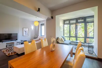 a dining room and living room with a table and chairs at Modern yet Rustic Style City Centre Apt 2BR/2BTH in Sofia