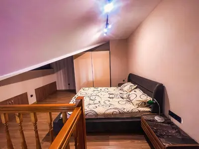 a small bedroom with a bed in the attic at IZ VIEW Apartment in Bansko