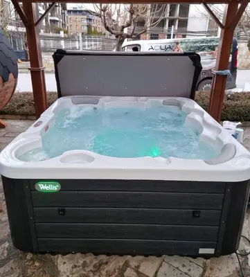 a jacuzzi tub sitting on the ground at Garden apartment Aspen Suites A008 in Bansko