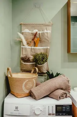 a washing machine with various items on top of it at Elegant Living Apartment 2 in Sofia