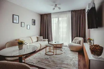 a living room with a couch and a table at Elegant Living Apartment 1 in Sofia