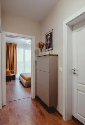 a room with a dresser and a bedroom at Elegant Living Apartment 1 in Sofia