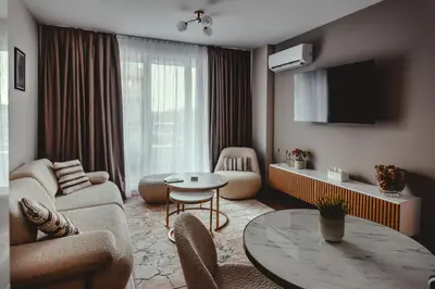 a living room with a couch and a table at Elegant Living Apartment 1 in Sofia