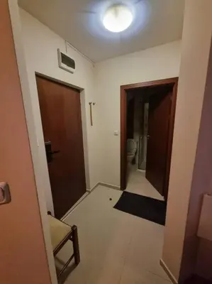 a room with a hallway with a toilet and two doors at Domo 12 Belmont, Bansko in Bansko