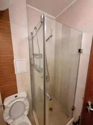 a bathroom with a shower and a toilet at Domo 12 Belmont, Bansko in Bansko