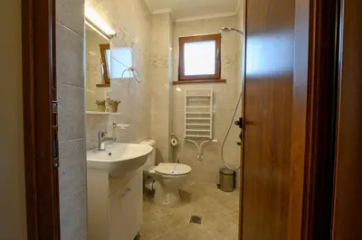a bathroom with a toilet and a sink and a shower at Rila Hills in Samokov