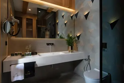 a bathroom with a sink and a toilet at Alpine Bell Villa in Banya