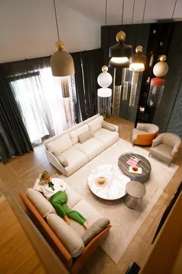 a living room with a couch and a table at Alpine Bell Villa in Banya