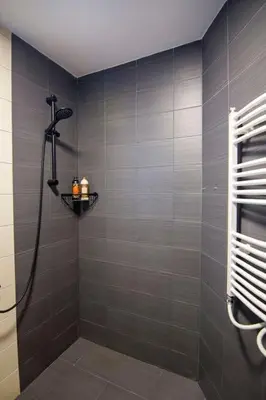 a bathroom with a shower with a shower head at Аpartment near Sofia airport in Sofia
